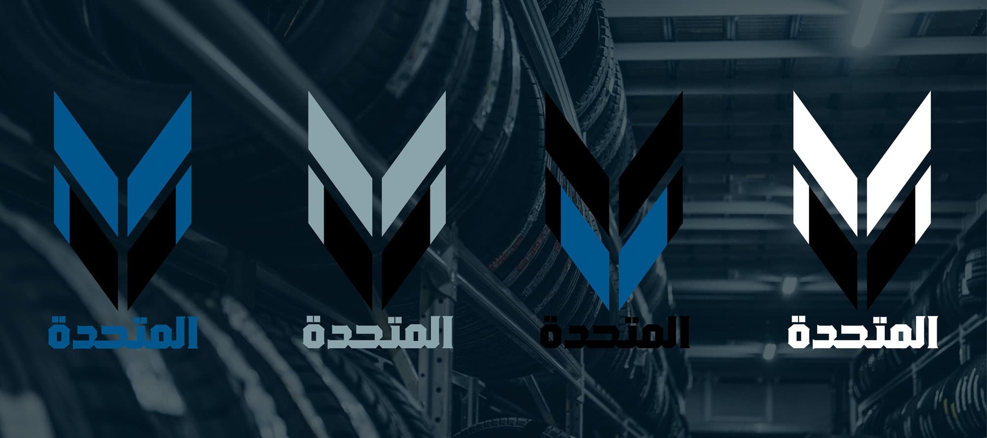 Four versions of the mark in blue, grey, black and white.