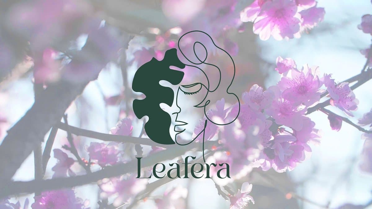 The Leafera mark, a woman’s face drawn in one line beside a dark green leaf, over pink blossoms.