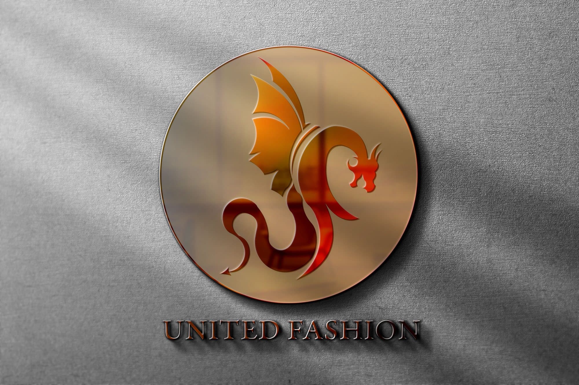 The United Fashion dragon in red and orange inside a circle, embossed on paper.