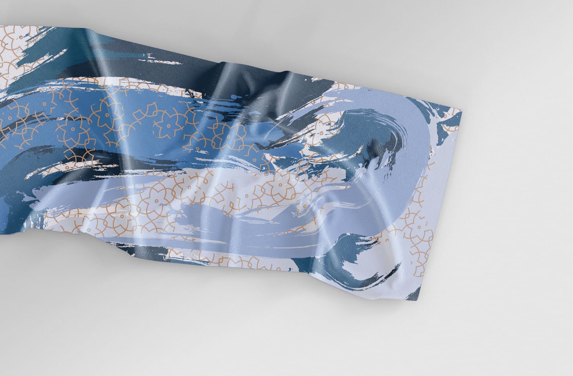 A second scarf in blue brush strokes with a fine gold pattern.