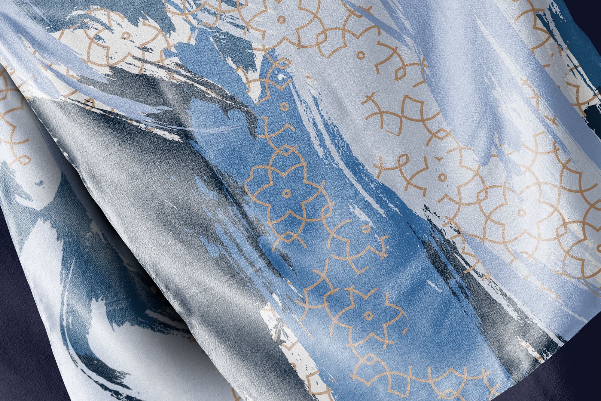 Close-up of the blue scarf’s brush strokes and gold geometric lines.