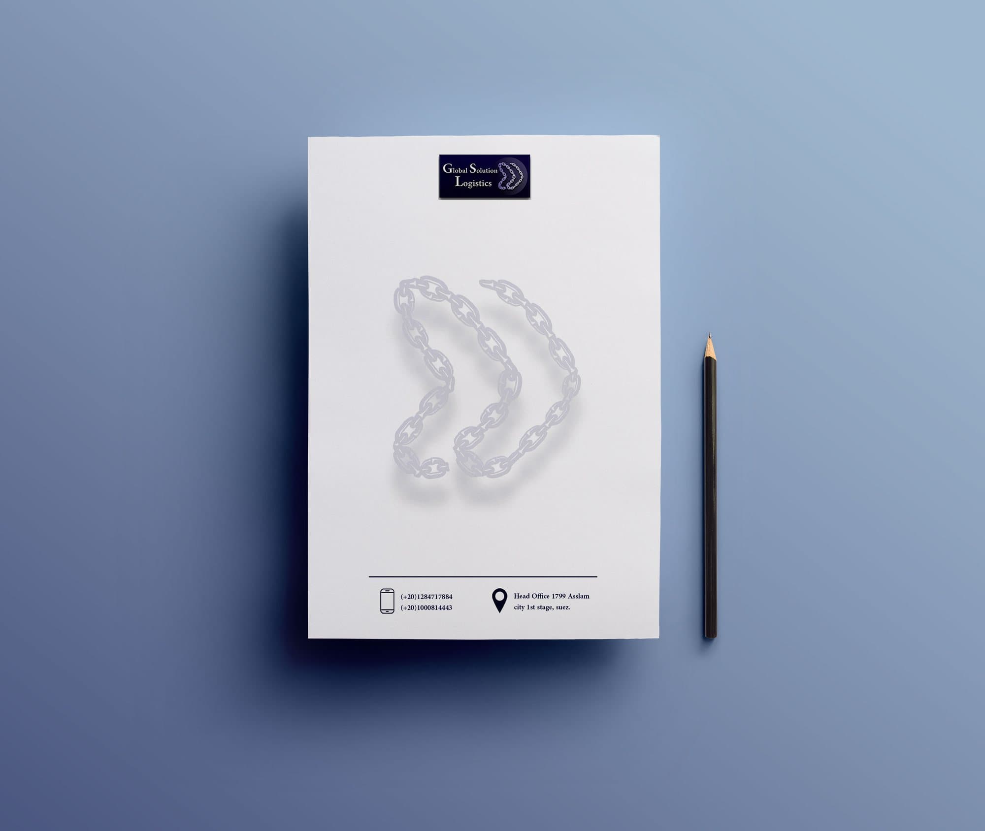 A GSL letterhead with the chain mark as a watermark, next to a pencil.