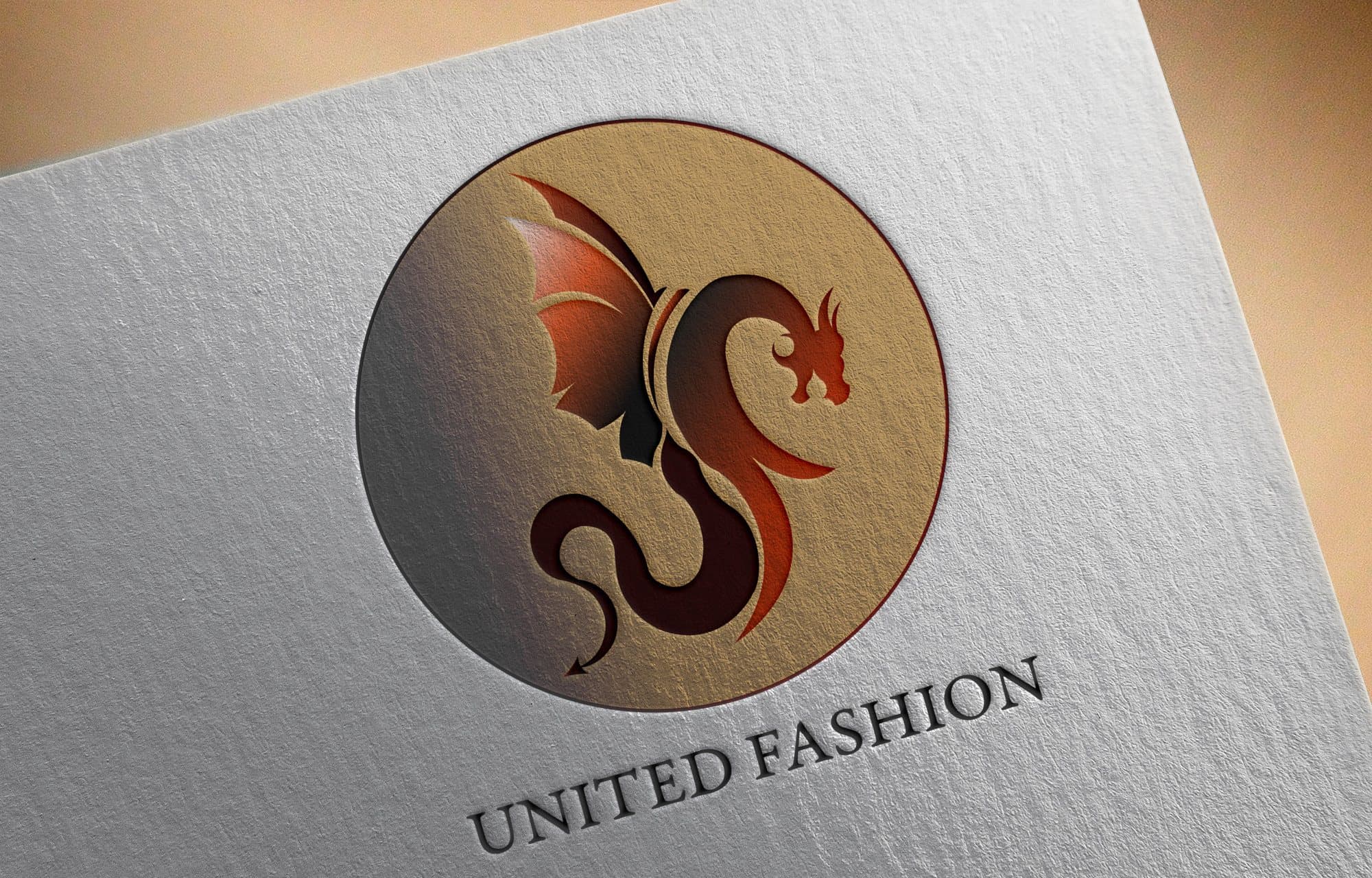The dragon logo with United Fashion set in a curve, on brown paper.